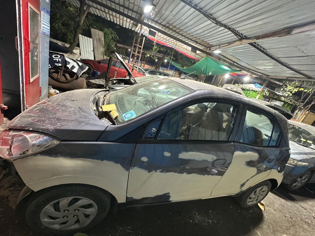 Vehicle body panels being prepared during bodywork