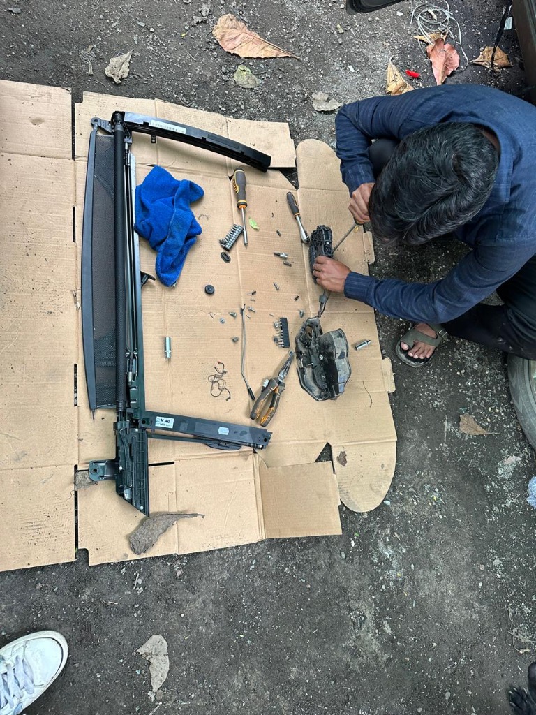 Workshop technician carrying out a vehicle component repair
