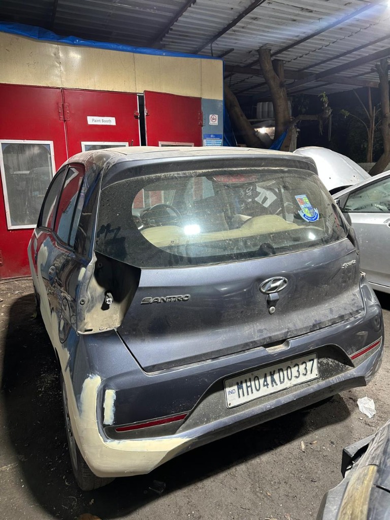 Vehicle body and paint repair in progress at the workshop